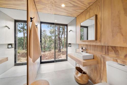 a bathroom with a sink and a mirror at Gabion Hill in Glenlyon