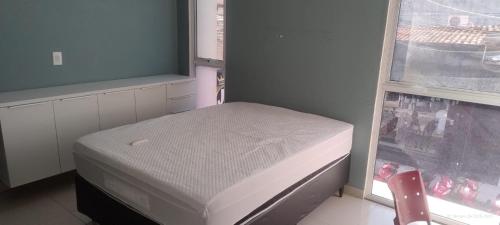 En eller flere senge i et værelse på Pousada Horbis