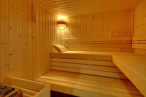 a wooden sauna with a light on top of it at Hotel Alba in Monte Gordo
