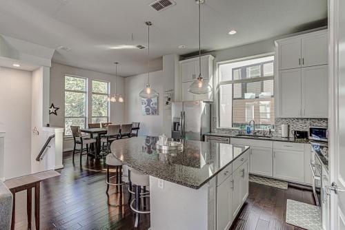 a kitchen with white cabinets and a counter top at Elegant 3 BED Home Walk To Riverwalk/Pearl/St Mary in San Antonio