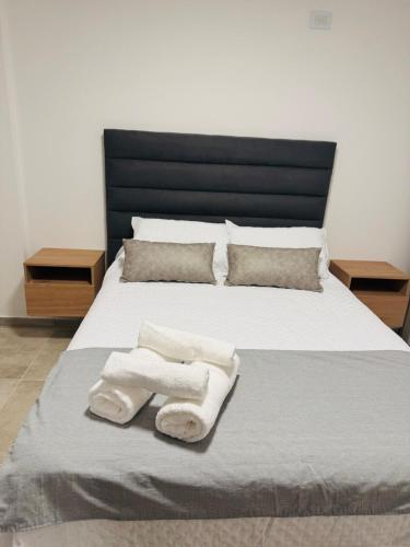 En eller flere senge i et værelse på AF-Homes-Villa María