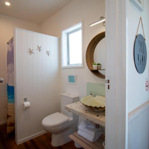 a bathroom with a toilet and a sink at Leigh Central in Leigh