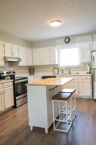 a kitchen with white cabinets and a counter top at 3BR Retreat near BrewDog, games, and lots of space in Groveport