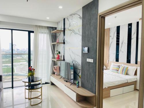 a bedroom with a bed and a tv in it at JULY Homestay Nera huế in Thôn Văn Dương