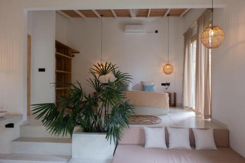 En eller flere senge i et værelse på Kiki Studios