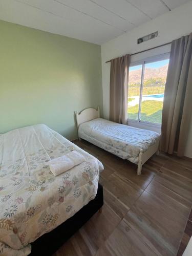 En eller flere senge i et værelse på Casa Fika