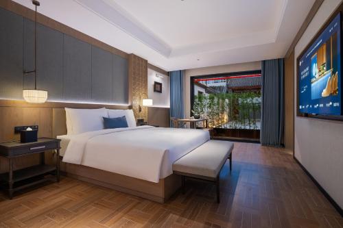 Postel nebo postele na pokoji v ubytování Manxin Mansion, Tiananmen Square, Forbidden City, Beijing