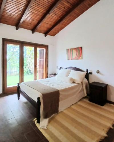 En eller flere senge i et værelse på Casa de Playa