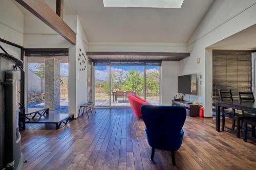 a living room with a couch and a table at The Deer Valley Yamanakako in Yamanakako