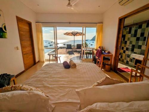 Ένα ή περισσότερα κρεβάτια σε δωμάτιο στο Villa Molas Mongko