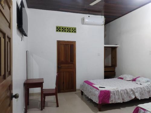 Ένα ή περισσότερα κρεβάτια σε δωμάτιο στο Hospedaje Sadicita