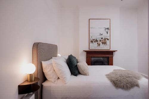 Ένα ή περισσότερα κρεβάτια σε δωμάτιο στο Harrington House - inner-city luxury apartment