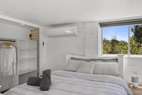 Ένα ή περισσότερα κρεβάτια σε δωμάτιο στο The Boat House