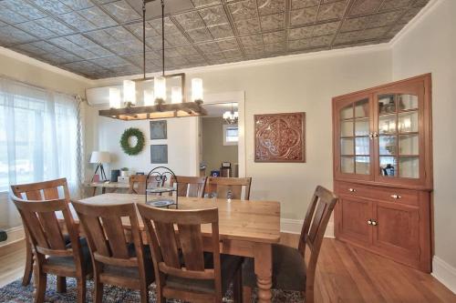 a dining room with a wooden table and chairs at 5th St Bungalow - Historic Charm Near 3rd St in McMinnville