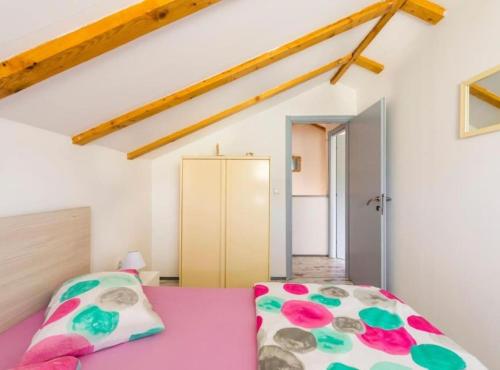 En eller flere senge i et værelse på Village Holiday House Ivan Kozina