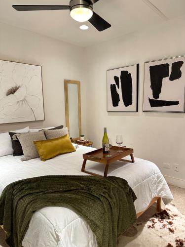 a bedroom with a bed with a table on it at 2Level Duplex with Jaccuzi-Gem in Chicago 4BD&3BA in Chicago