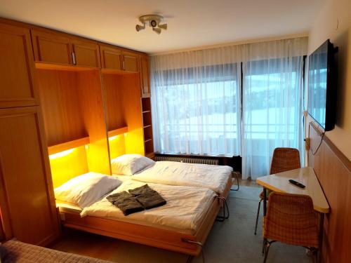 Giường trong phòng chung tại Bad Gastein Holiday Apartments