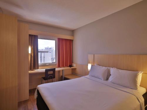 Ένα ή περισσότερα κρεβάτια σε δωμάτιο στο ibis Recife Boa Viagem