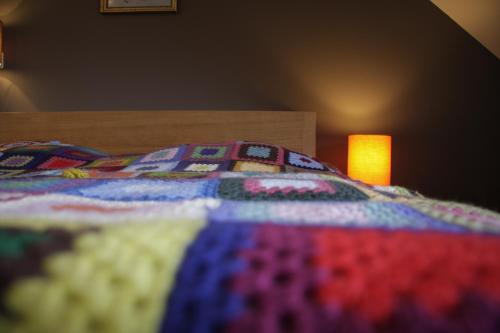 Una cama o camas en una habitación de De Weide Wereld
