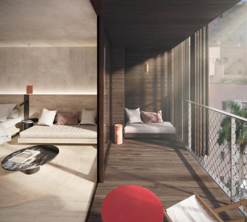 En eller flere senge i et værelse på Terreno Barrio Hotel