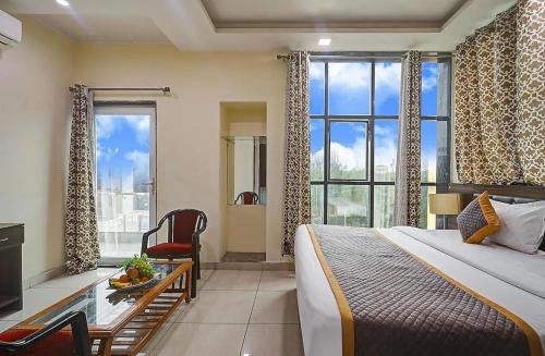 Ένα ή περισσότερα κρεβάτια σε δωμάτιο στο Hotel Vibe Blue