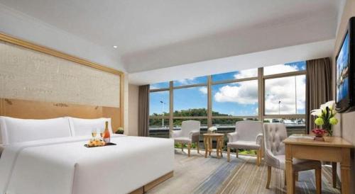 Ένα ή περισσότερα κρεβάτια σε δωμάτιο στο GreenTree Alliance Hotel Shenzhen Futian District Xiangmi Lake Xiangmei Mountain Metro Station