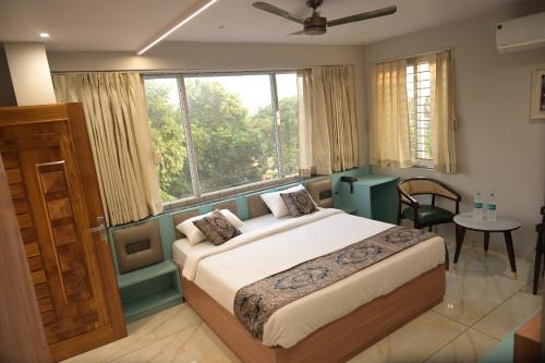 Ένα ή περισσότερα κρεβάτια σε δωμάτιο στο Hotel Spot Light