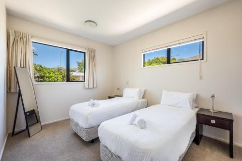 En eller flere senge i et værelse på Dragonfly Cottage