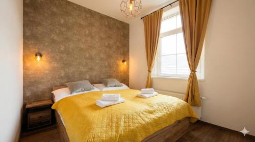 Ένα ή περισσότερα κρεβάτια σε δωμάτιο στο Samaya Apartment