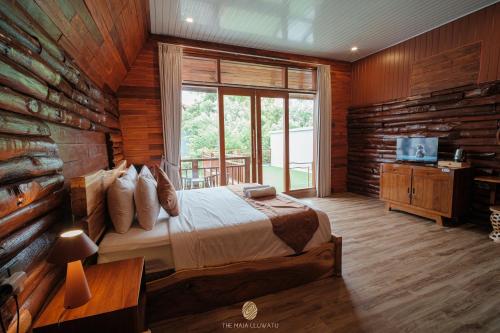 En eller flere senge i et værelse på The Maja Villa Uluwatu