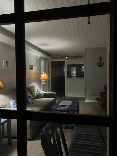 a living room with a couch and a table at Lakeland House in Langley