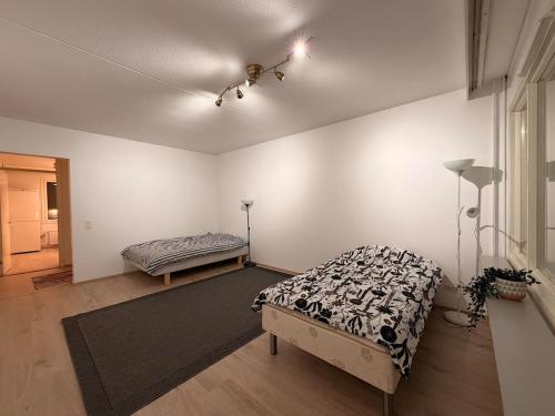 a bedroom with a bed and a bed sidx sidx sidx at Helsinki Matinkylä Apartment in Espoo