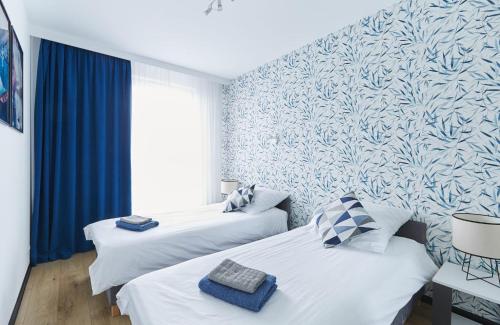 Ένα ή περισσότερα κρεβάτια σε δωμάτιο στο Apartament Pileckiego Nowy Dwór Mazowiecki Airport Modlin 24 H