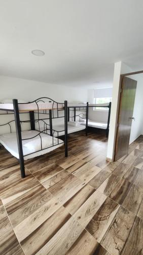 Un pat sau paturi într-o cameră la Canela Melgar-Vda-Bombote