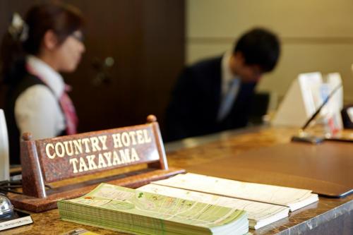 a sign that says country hotel kazimka on a table at Country Hotel Takayama in Takayama