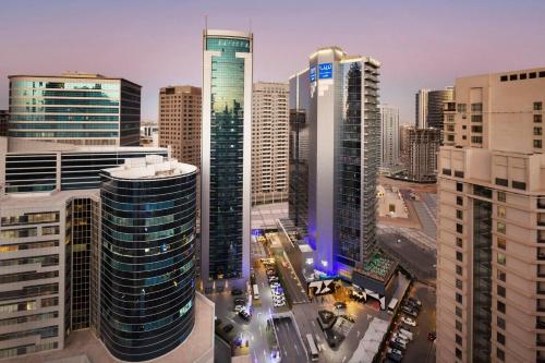an aerial view of a city with tall buildings at TRYP by Wyndham Dubai in Dubai