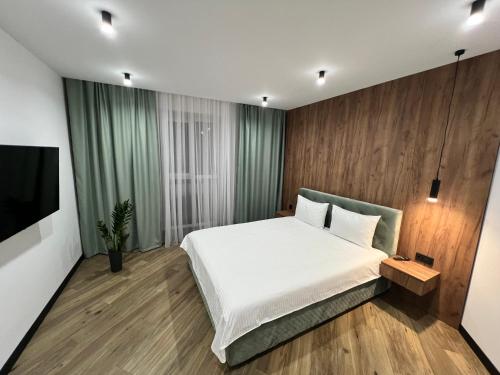 Ένα ή περισσότερα κρεβάτια σε δωμάτιο στο Сучасні апартаменти в районі автовокзалу ЖК Great House,поруч обласна лікарня,центр