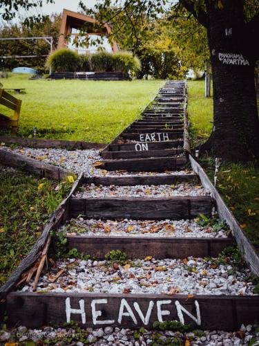 a set of stairs with the words earth on at Panorama Glamping Visole in Slovenska Bistrica