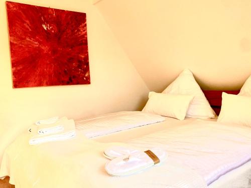 En eller flere senge i et værelse på Traumhaftes Apartment mit Dachterrasse und Schlossblick