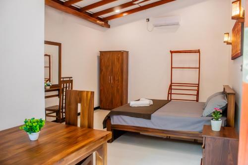 Ένα ή περισσότερα κρεβάτια σε δωμάτιο στο Mila Guest Bentota