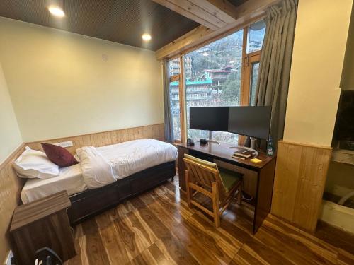 Postel nebo postele na pokoji v ubytování Shiva Den