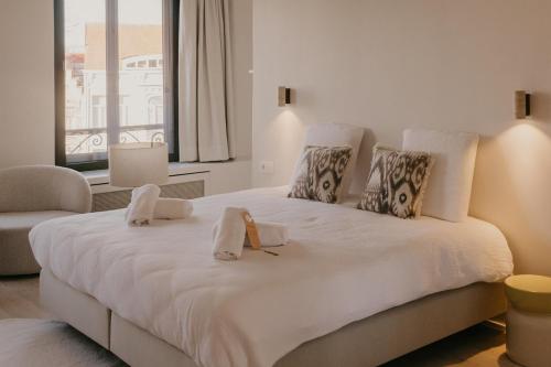 Un pat sau paturi într-o cameră la Isidore