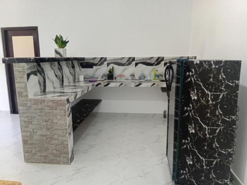 Un pat sau paturi într-o cameră la Nikita Homestay