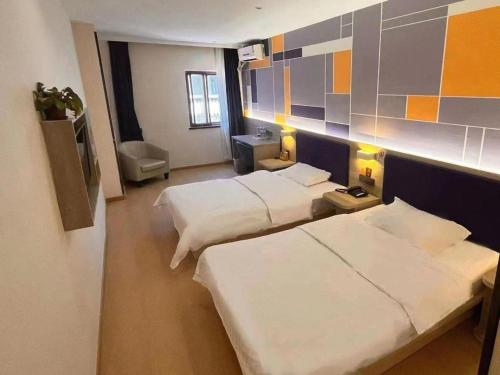 Ένα ή περισσότερα κρεβάτια σε δωμάτιο στο 7 Days Premium·Tianjin Gulou Metro Station Joy City