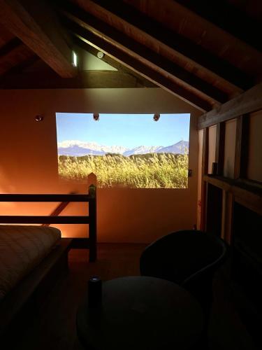 a room with a large window with a view at The Bath and Bed Tateyama in Toyama