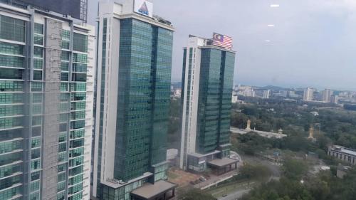 two tall skyscrapers in a city with at Cyberjaya Studio Suite By NSB in Cyberjaya