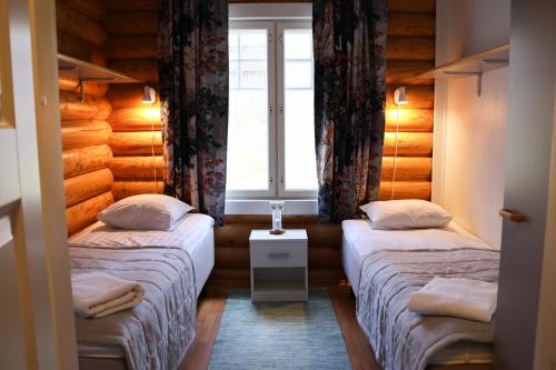 Ένα ή περισσότερα κρεβάτια σε δωμάτιο στο Marttinen