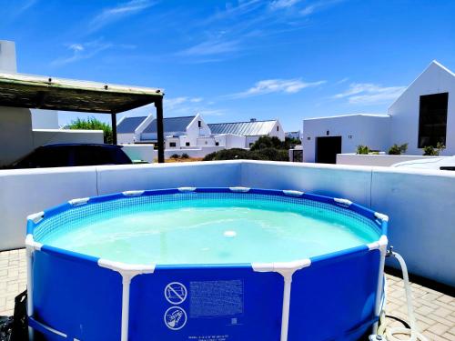 a hot tub on the roof of a house at Mosseltjie - Self Catering in Britannia Bay