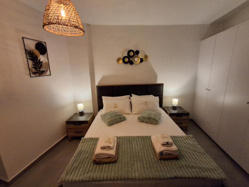 Giường trong phòng chung tại Lazuli City Center Ap 11