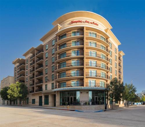 a large apartment building with a round top at Hampton Inn & Suites Baton Rouge Downtown in Baton Rouge